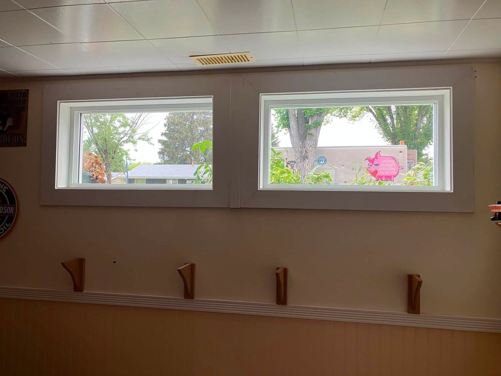 After: the same basement wall with new dual-pane windows