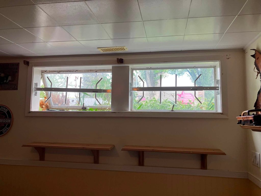 Before: basement wall with the old single-pane windows