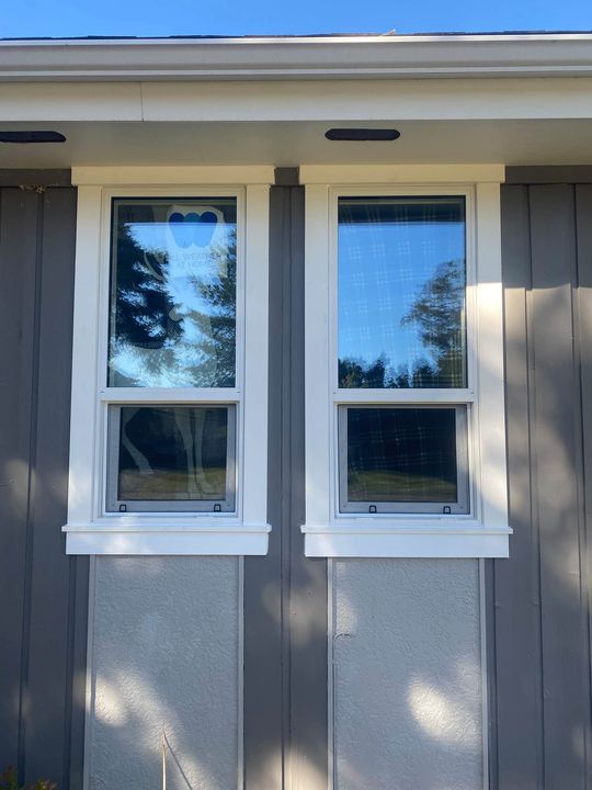 Two new triple-pane windows side by side with custom trim